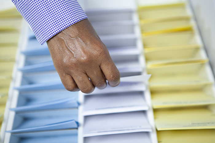 Hand choosing ballot paper