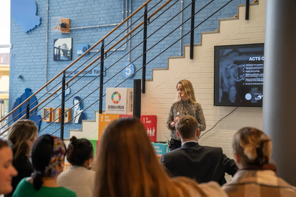 A woman holding a lecture for students