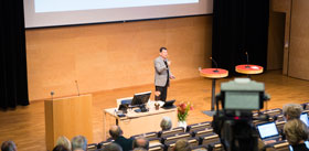 Lecturer in a big lecture hall